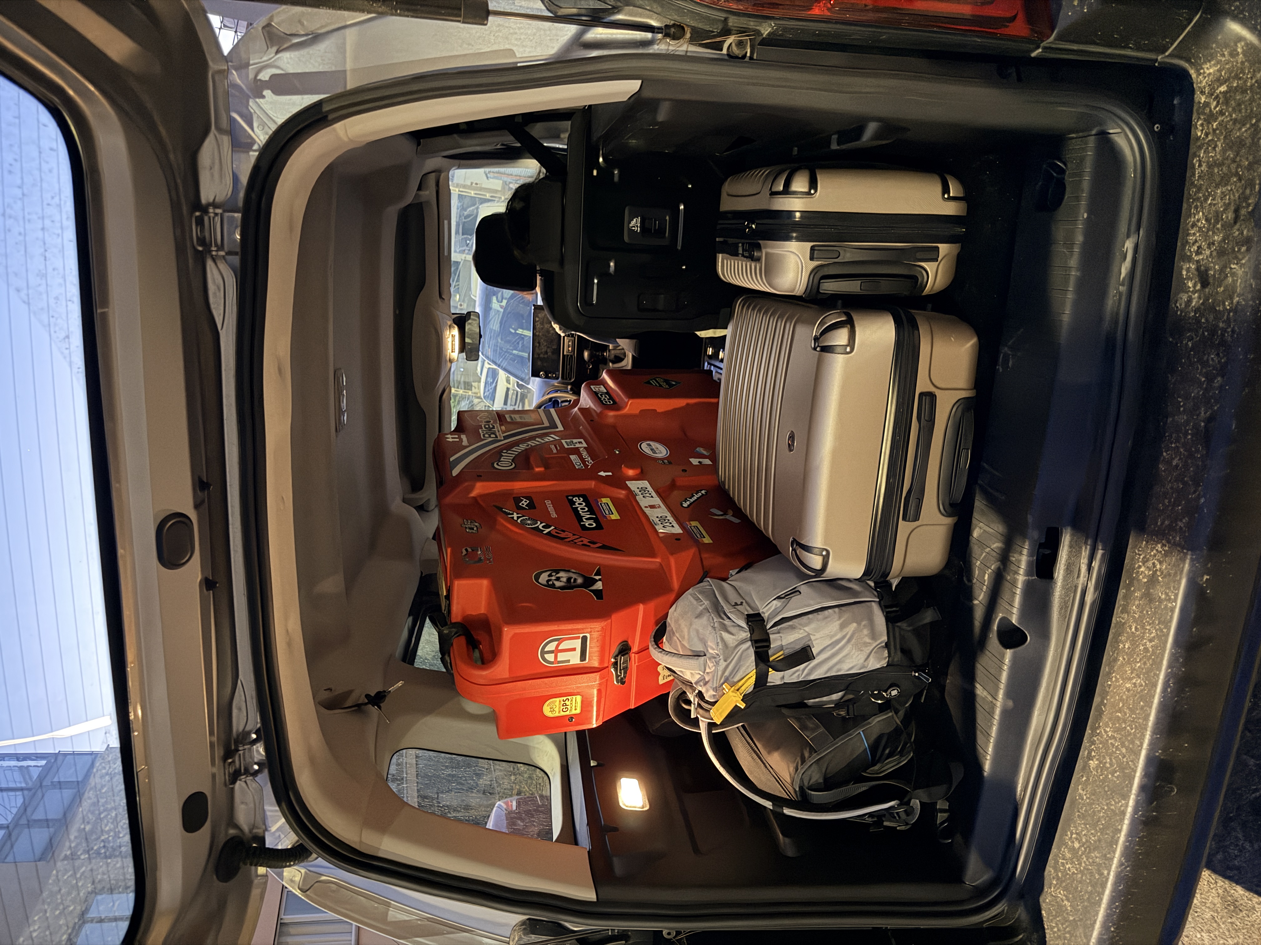 Citroën Berlingo boot loaded with bike box, suitcases and rucksack