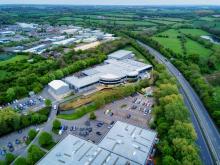Recruitment Agency in Brackley|Racing bicycle in blurred motion speeding down the road.|Brackley recruitment agency supporting many automotive businesses in the area.|Recruitment agency in Brackley with great transport links.